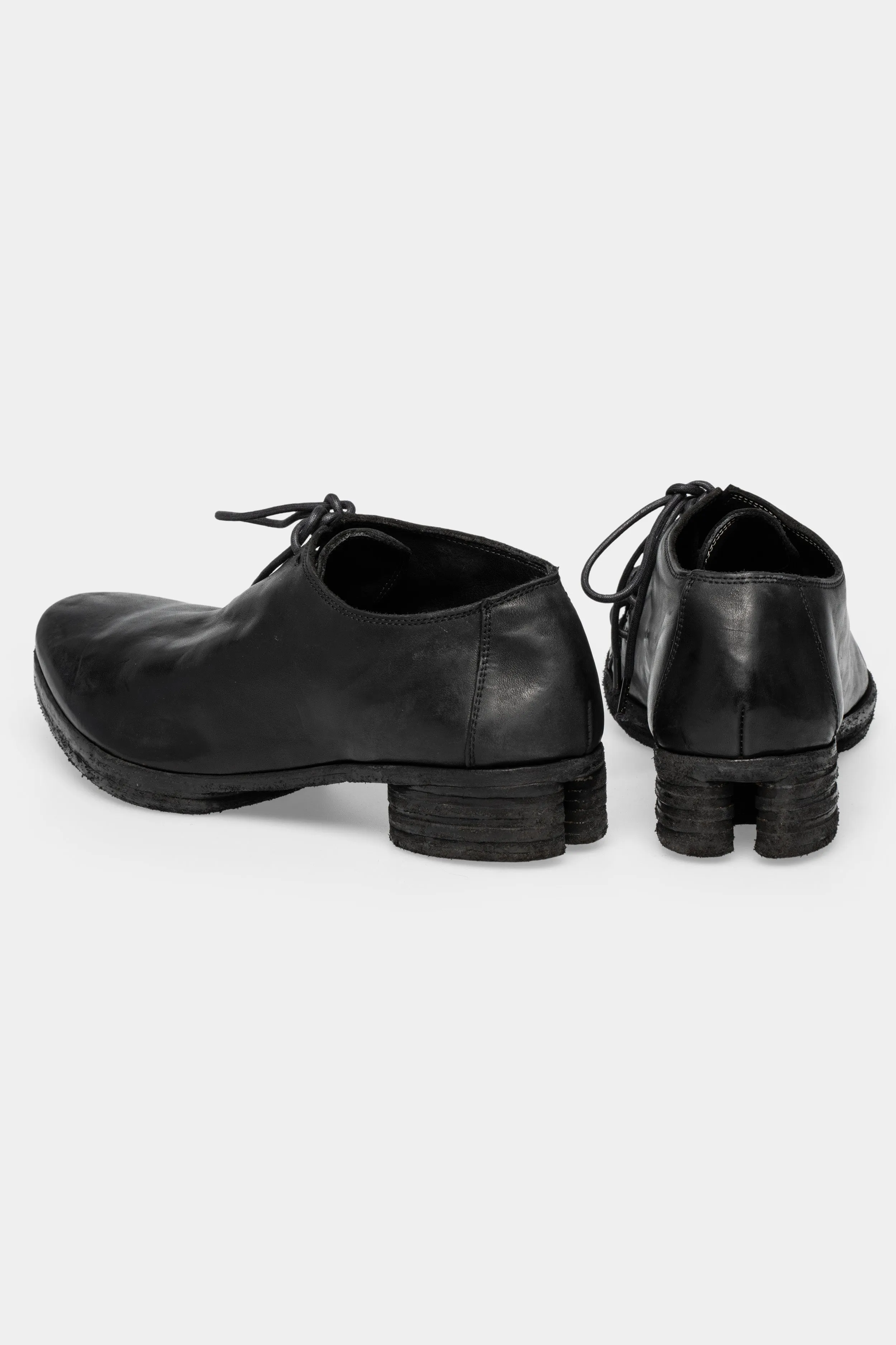 Asymmetrical laced leather horseshoe heel derbies