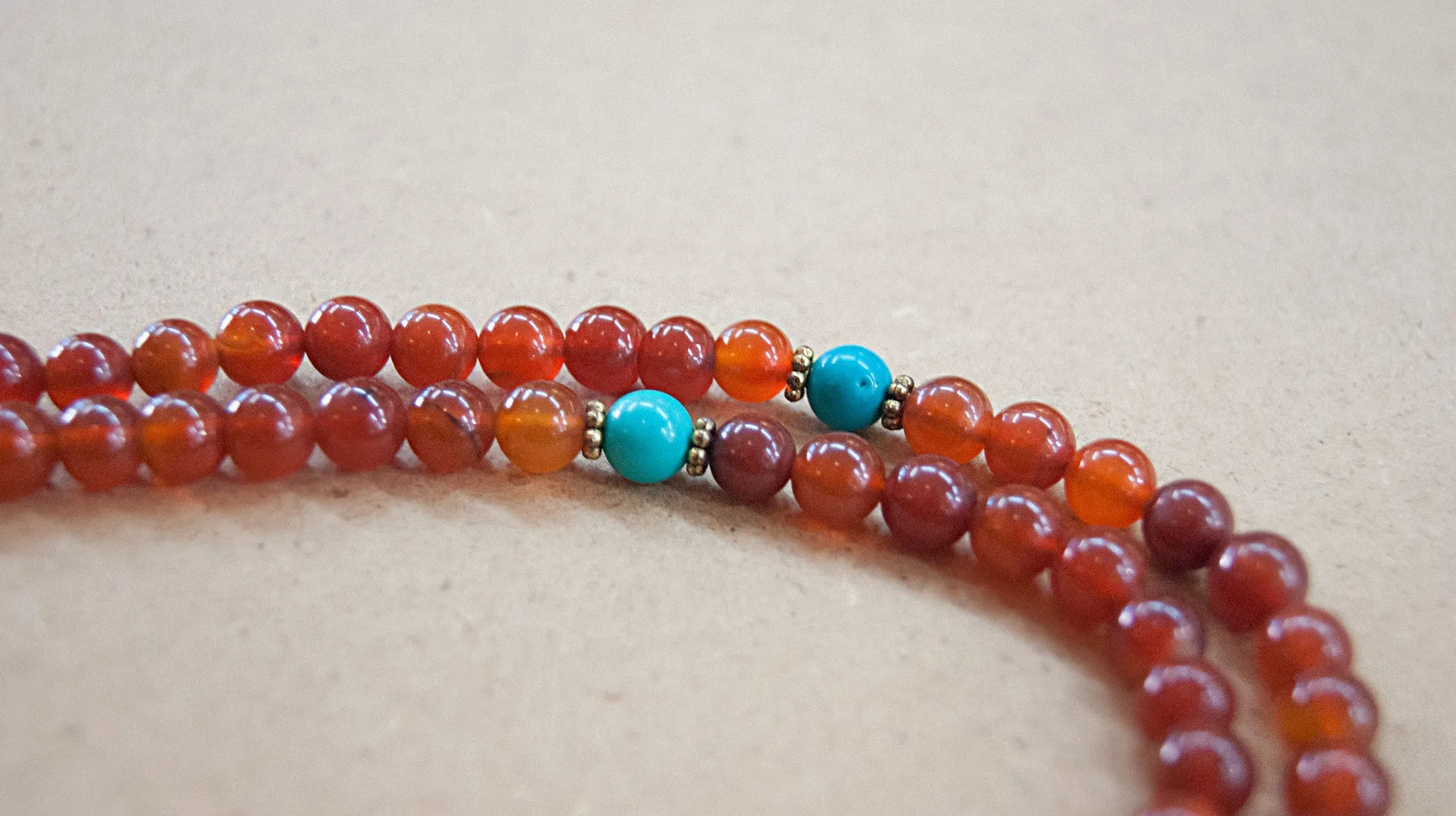 Carnelian Mala bead with Turquoise spacers